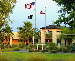 Veterans home with flags waving