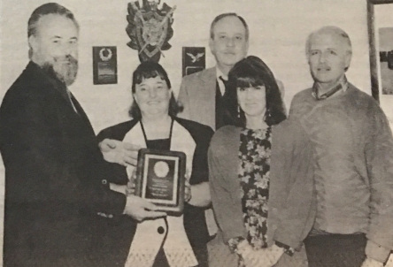 Bob Hunt accepting award from ft.irwin staff