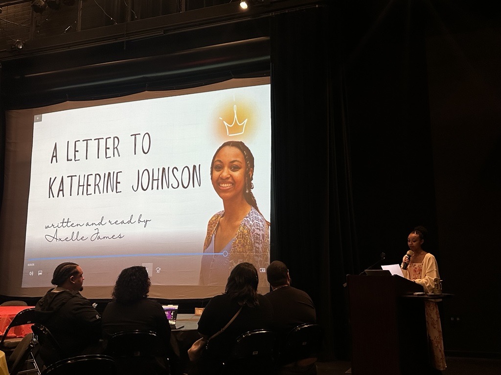 Axelle James reading their entry
