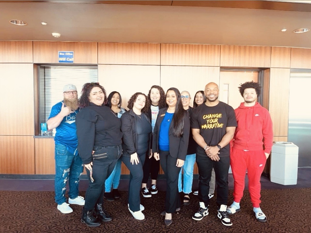 staff and students with DJ Johnson, motivational speaker