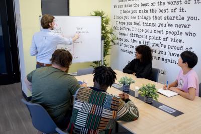 Teacher teaching coding