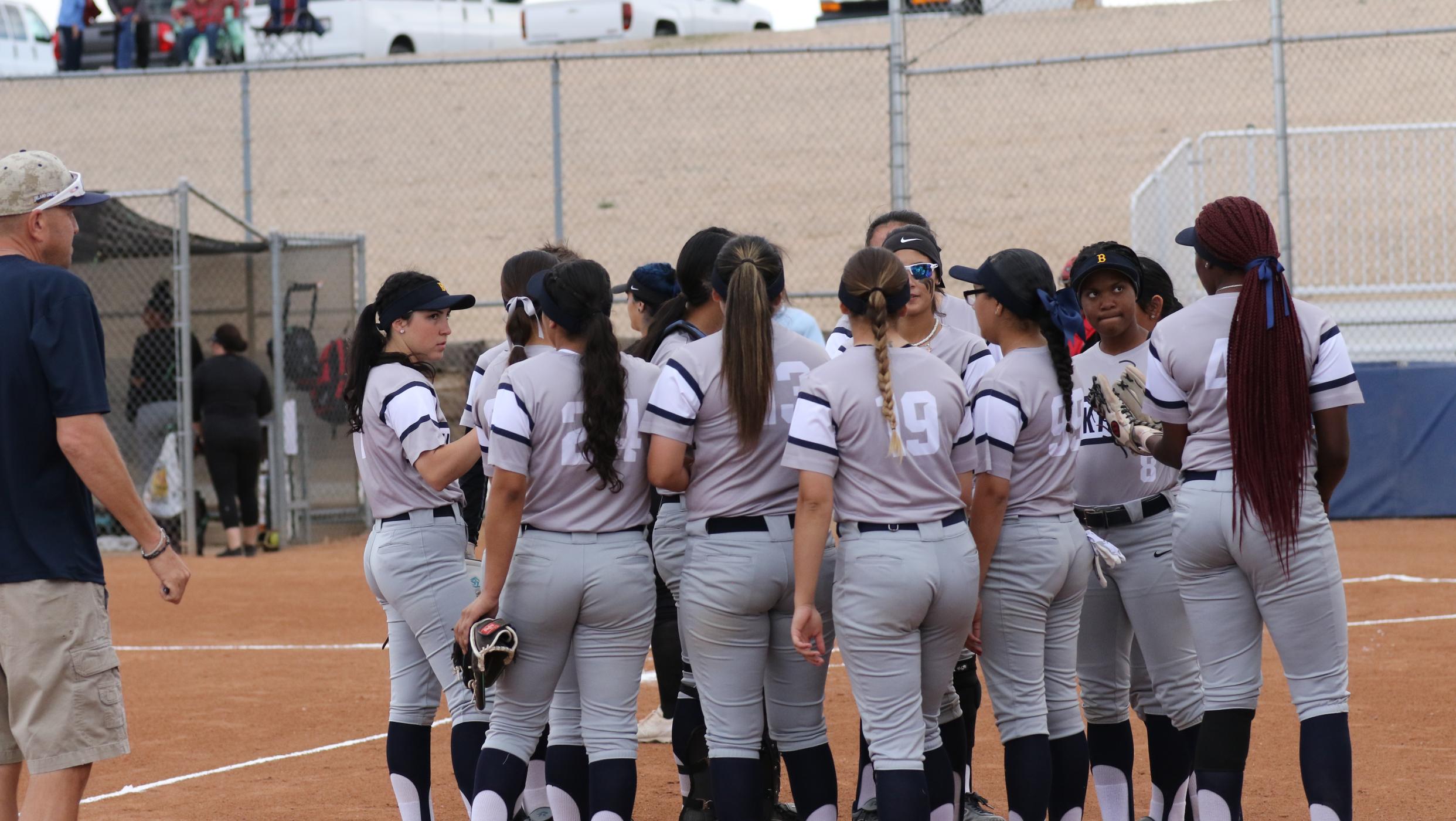 Women's Softball team huddling