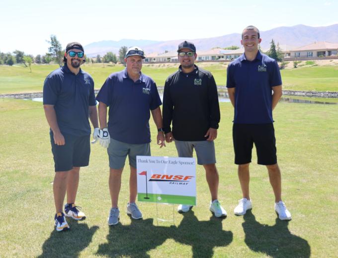 Golf players posing for pictures