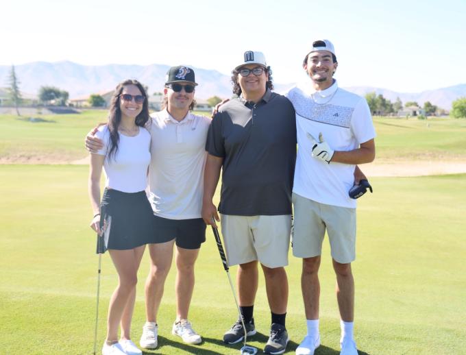 Golf players posing for pictures