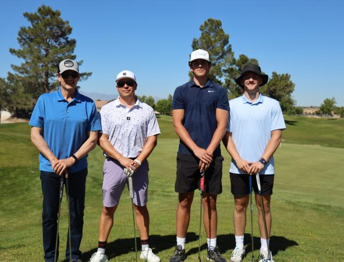 Golf players posing for pictures