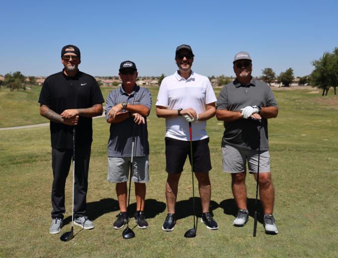 Golf players posing for pictures