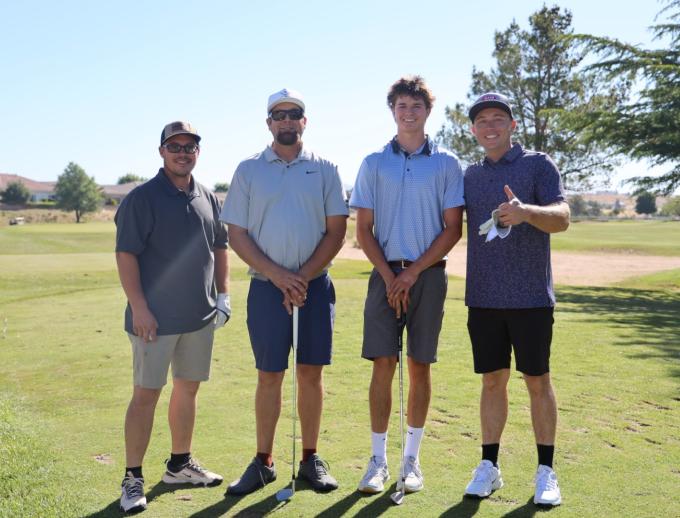 Golf players posing for pictures