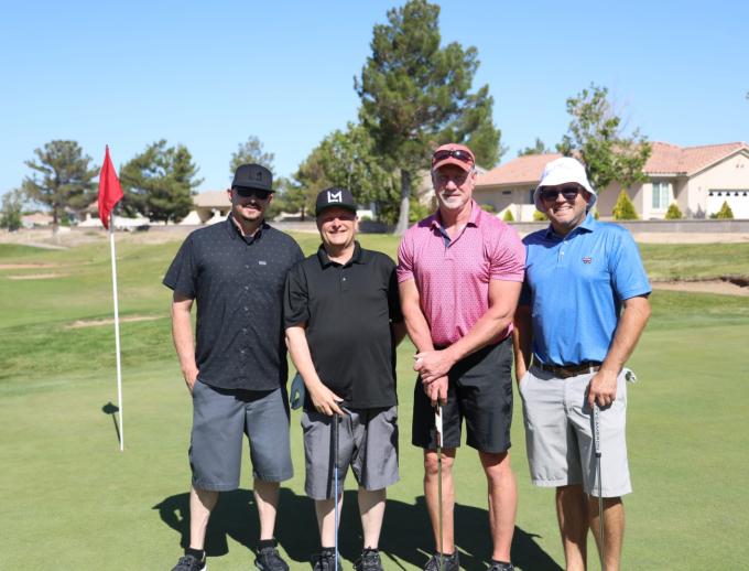 Golf players posing for pictures