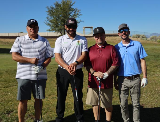 Golf players posing for pictures
