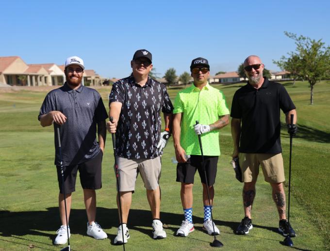 Golf players posing for pictures