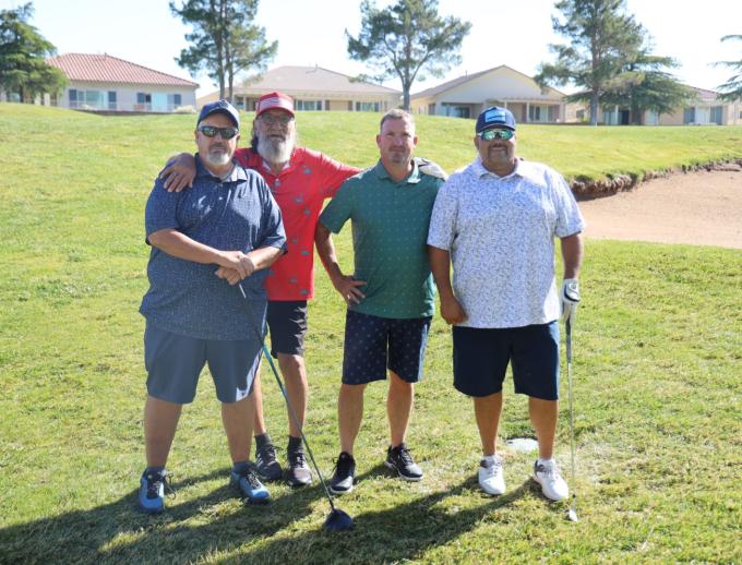 Golf players posing for pictures