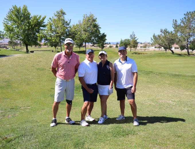 Golf players posing for pictures