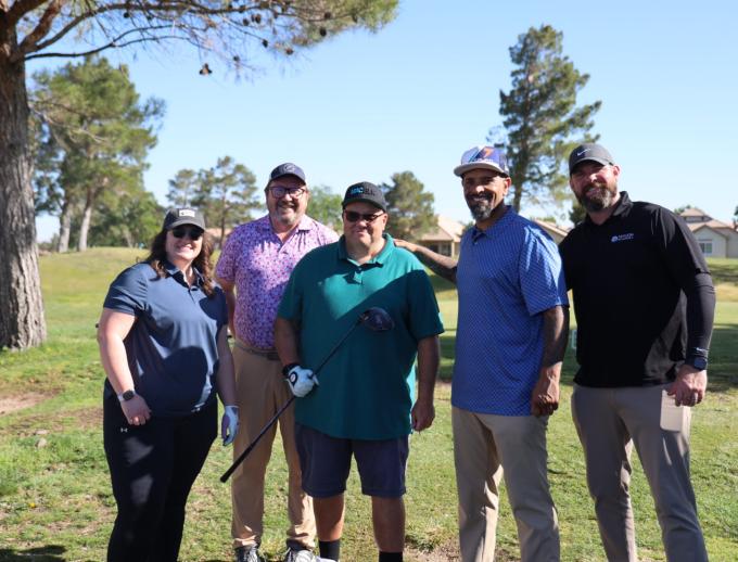 Golf players posing for pictures